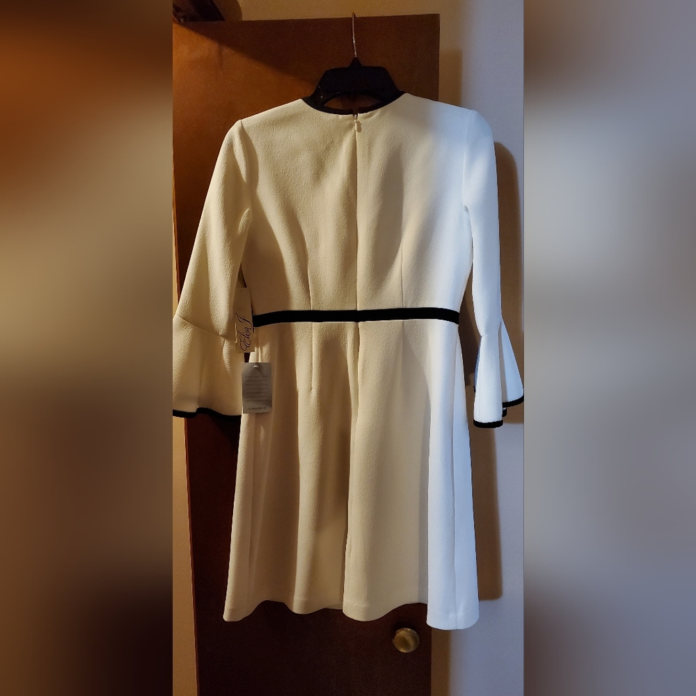 Elegant White A-Line Dress with Black Trim